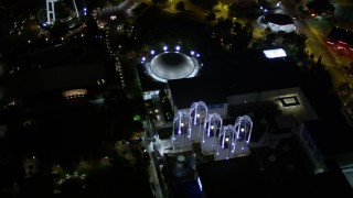 AX51_057 - 5K aerial stock footage of a bird's eye view of the Pacific Science Center at Seattle Center, Downtown Seattle, Washington, night