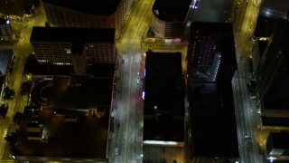 AX51_058E - 5K aerial stock footage of bird's eye view of 3rd Avenue through Downtown Seattle, Washington, night