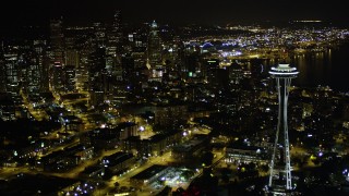 AX51_067 - 5K aerial stock footage flyby the Space Needle to approach Downtown Seattle skyscrapers, Washington. night