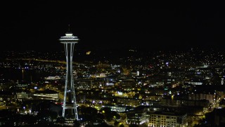 AX51_074 - 5K aerial stock footage of slow approach to the top of the Space Needle, Downtown Seattle, Washington, night