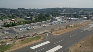 AX52_001E - 5K aerial stock footage of lifting off from Renton Municipal Airport, Washington