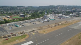 AX52_002 - 5K aerial stock footage of parked airliners at Renton Municipal Airport, Washington