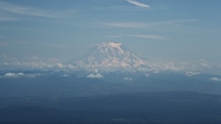 AX52_003 - 5K aerial stock footage of Mount Rainier with snow, Cascade Range, Washington