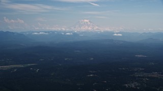 AX52_004 - 5K aerial stock footage of Mount Rainier with snow, an active volcano in Cascade Range, Washington