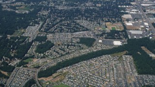 AX52_005 - 5K aerial stock footage of reverse view of suburban neighborhoods in Renton, Washington