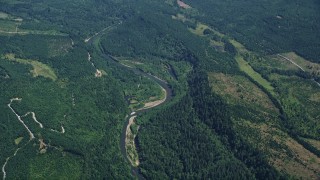 AX52_008 - 5K aerial stock footage of Skookumchuck River and evergreen forest in Thurston County, Washington