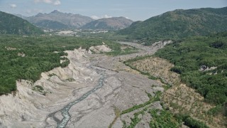 AX52_037 - 5K aerial stock footage pan across the sediment in the North Fok Toutle River, Washington