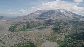 AX52_044 - 5K aerial stock footage approach Mount St. Helens and clouds capping the peak, Washington