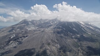 AX52_047 - 5K aerial stock footage of Mount St. Helens crater and cloud cover, Washington