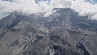 AX52_049 - 5K aerial stock footage pass the Mount St. Helens crater with clouds, Washington