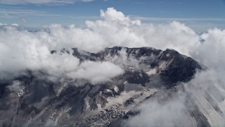 AX52_061 - 5K stock footage aerial video of Mount St. Helens crater ringed by cloud coverage, Washington