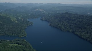 AX52_066 - 5K aerial stock footage of Lake Merwin, surrounded by evergreens, Cowlitz County, Washington