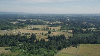 AX52_081 - 5K aerial stock footage flyby small farms and evergreen trees in La Center, Washington