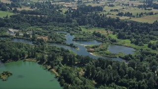 AX52_083 - 5K aerial stock footage approach the East Fork of the Lewis River in Ridgefield, Washington