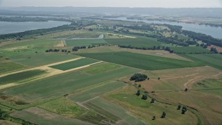 AX52_093E - 5K aerial stock footage of wide green farm fields in Vancouver, Washington