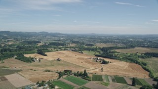 AX52_112 - 5K aerial stock footage of large fields around farms in Hillsboro, Oregon
