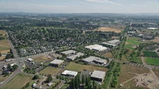AX52_113 - 5K aerial stock footage of suburban neighborhood across the street from office buildings, Hillsboro, Oregon