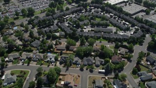 AX52_117 - 5K aerial stock footage fly over suburban homes to approach apartment buildings in Hillsboro, Oregon