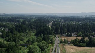 AX52_118 - 5K aerial stock footage of road through a suburban neighborhood in Hillsboro, Oregon