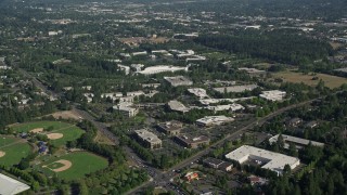 AX53_004E - 5K aerial stock footage of Nike Headquarters beside a lake, Beaverton, Oregon