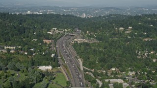 AX53_009 - 5K aerial stock footage of following a highway through residential neighborhoods, Southwest Portland, Oregon