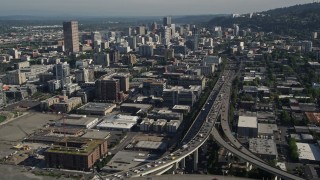 AX53_024E - 5K aerial stock footage fly along Interstate 405 and city buildings and skyscrapers, Downtown Portland, Oregon