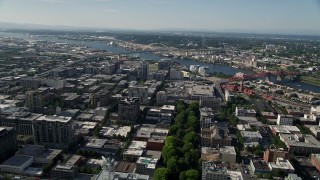 AX53_034E - 5K aerial stock footage approach and orbit Fremont Bridge and Willamette River from Downtown Portland, Oregon