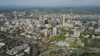 AX53_043 - 5K stock footage aerial video fly by Downtown Portland buildings and Portland State University, Oregon