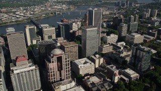 AX53_045 - 5K aerial stock footage of flying over skyscrapers and track KOIN Center, Downtown Portland, Oregon