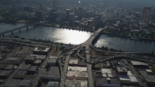 AX53_048E - 5K aerial stock footage fly over Morrison Bridge and Willamette River toward Downtown Portland, Oregon