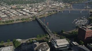 AX53_054 - 5K aerial stock footage tilt to bird's eye view of the Steel Bridge spanning Willamette River, Downtown Portland, Oregon