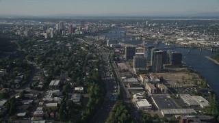 AX53_059E - 5K aerial stock footage of city sprawl, skyscrapers, high-rises and river, Downtown Portland, Oregon