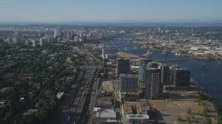 AX53_060 - 5K aerial stock footage of city sprawl, skyscrapers, high-rises and river, Downtown Portland, Oregon