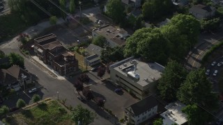 AX53_065 - 5K aerial stock footage track gondolas over city streets, Southwest Portland, Oregon