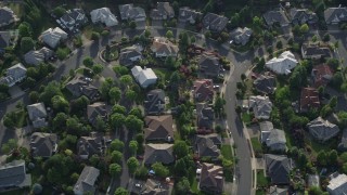 AX53_099 - 5K aerial stock footage tilt down to bird's eye of a residential neighborhood, Beaverton, Oregon