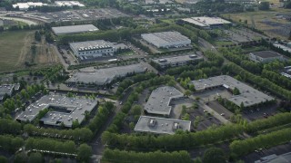 AX53_103 - 5K aerial stock footage of flying over one-story office buildings and warehouses, Hillsboro, Oregon