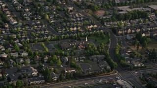 AX54_002 - 5K stock footage aerial video of passing the Church of Jesus Christ of Latter Day Saints, Beaverton, Oregon, sunset