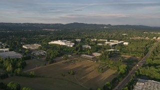 AX54_005E - 5K aerial stock footage of flying by Nike Headquarters, Beaverton, Oregon, sunset