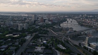 AX54_037E - 5K aerial stock footage approach and fly over KOIN Center, Wells Fargo Center, Downtown Portland, Oregon, sunset