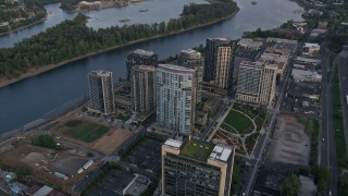 AX54_051 - 5K aerial stock footage of approaching South Waterfront, Portland, Oregon, sunset