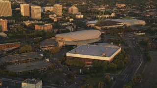 AX54_064 - 5K stock footage aerial video of Rose Garden Arena, Memorial Coliseum, Oregon Convention Center, Portland, Oregon, sunset