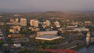 AX54_064E - 5K aerial stock footage of Rose Garden Arena, Memorial Coliseum, Downtown Portland, Oregon, sunset