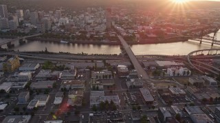 AX54_070E - 5K aerial stock footage of approaching Burnside Bridge and US Bancorp Tower, Downtown Portland, Oregon, sunset