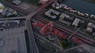 AX54_072 - 5K aerial stock footage of bird's eye view of Union Station in Downtown Portland, Oregon, sunset