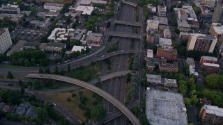 AX54_080E - 5K aerial stock footage of bird's eye view of following Interstate 405, Downtown Portland, Oregon, sunset