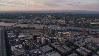 AX54_082 - 5K aerial stock footage of approaching Fremont Bridge from Downtown Portland, Oregon, sunset