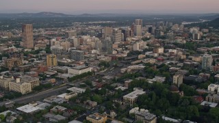 AX54_086E - 5K aerial stock footage fly over downtown, pan to KOIN Center and Wells Fargo Center, Downtown Portland, Oregon, sunset