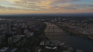 AX54_095 - 5K aerial stock footage of approaching bridges spanning the Willamette River in Downtown Portland, Oregon, twilight