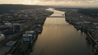 AX54_099 - 5K aerial stock footage of approaching the Fremont Bridge, Willamette River, Downtown Portland, Oregon, twilight