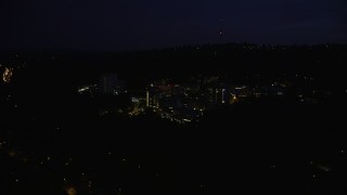 AX55_030 - 5K aerial stock footage of approaching Oregon Health and Science University, Portland, Oregon, night
